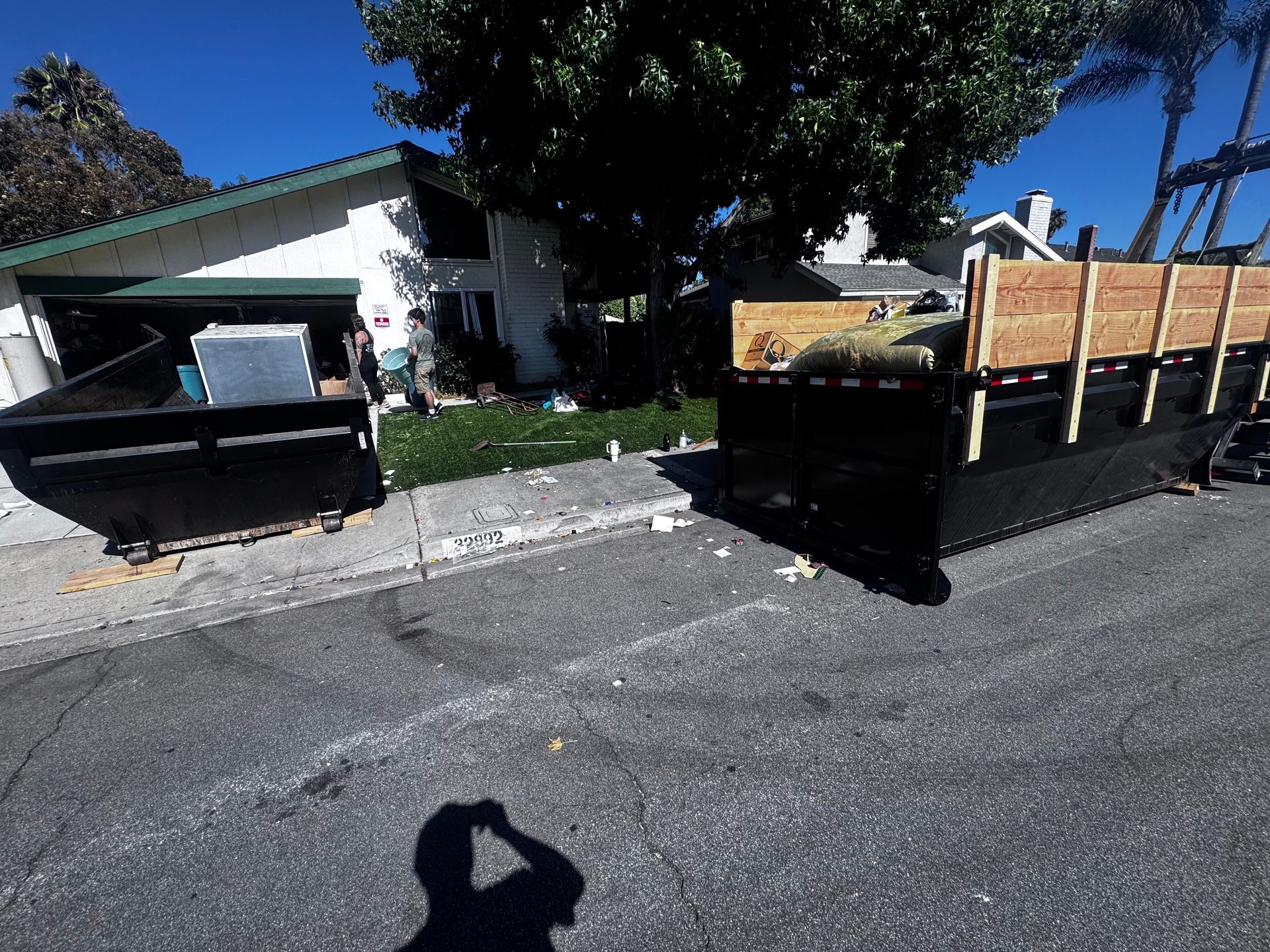 Two dumpsters on site during a home cleanout project
